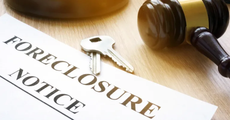 Foreclosure notice document next to house keys and a judge’s gavel, symbolizing the legal process of property repossession due to mortgage default.