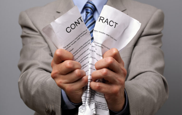 Man tearing up contract