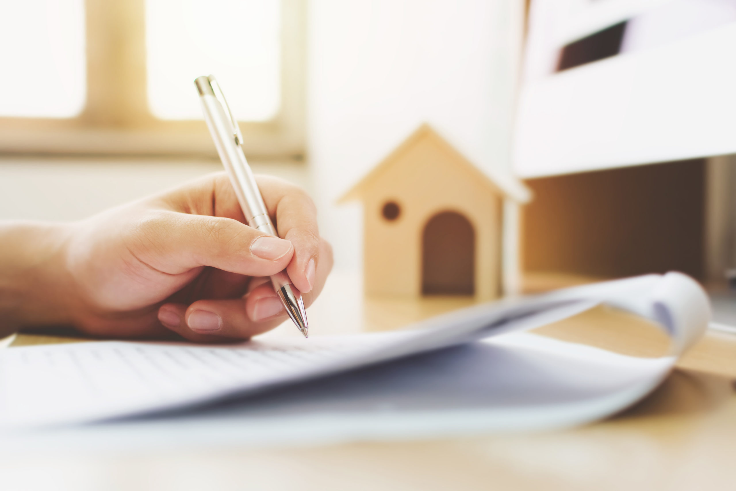 Man signing real estate document