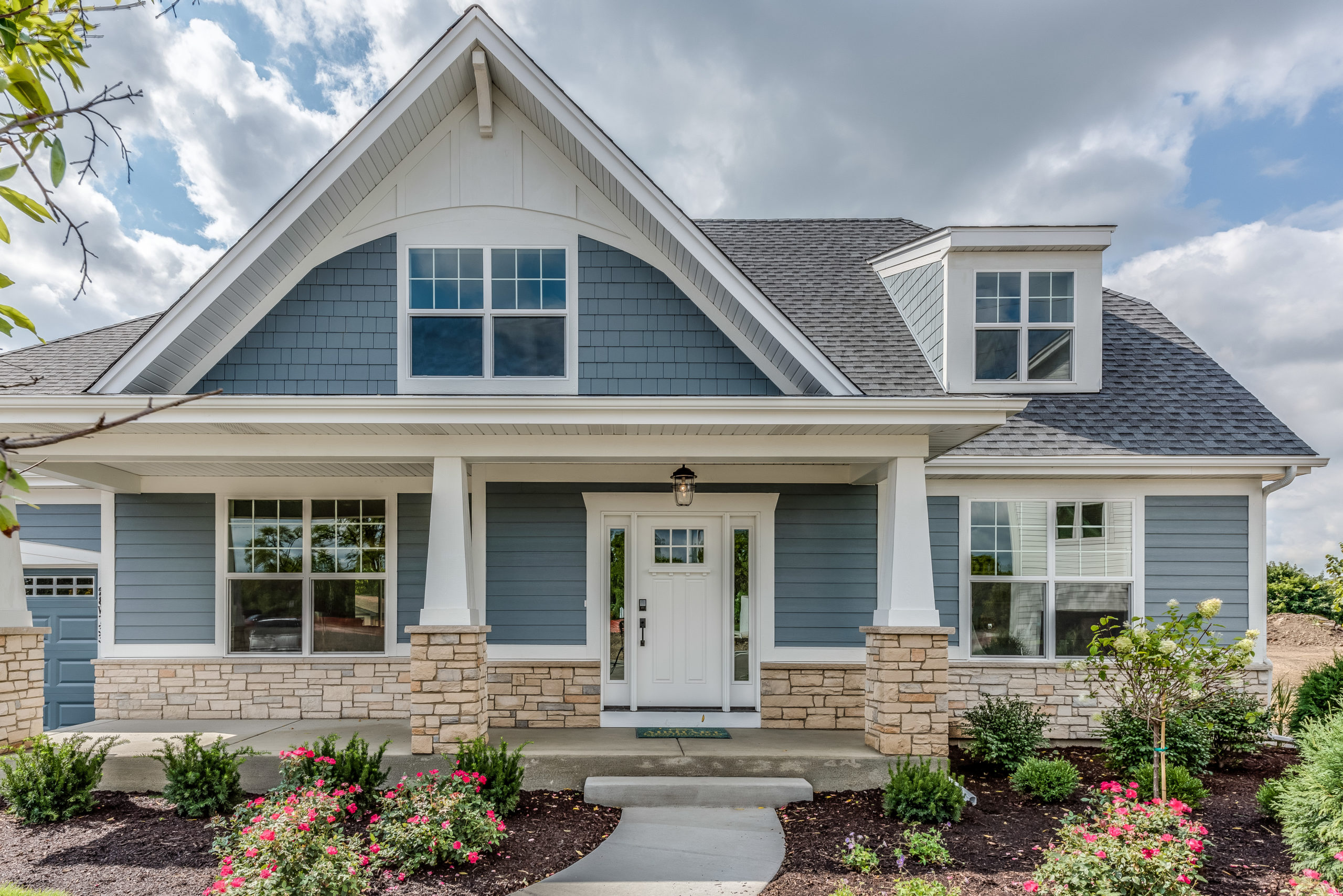 Front view of home with nicely landscaped front yard